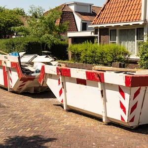 Two open steel industrial waste containers