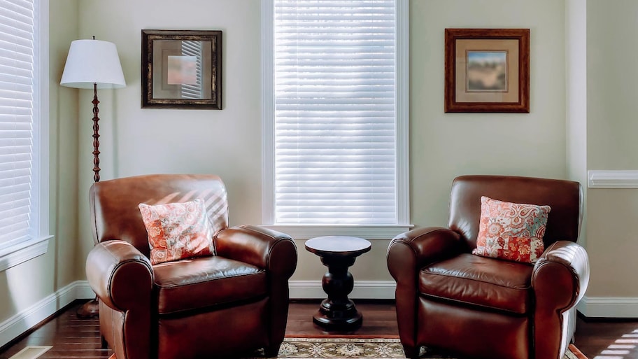 Two leather armchairs with a small side table in between