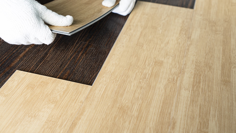 Professional installing vinyl flooring