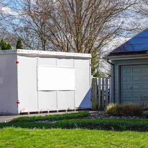 White storage pod unit in the driveway