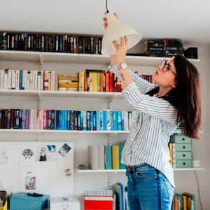 Woman changing bulb