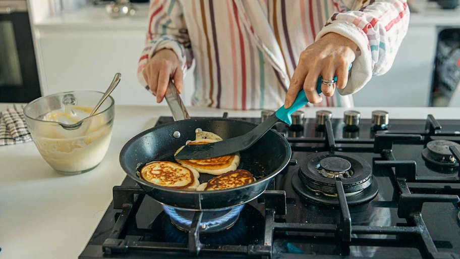 Woman cooking pancakes