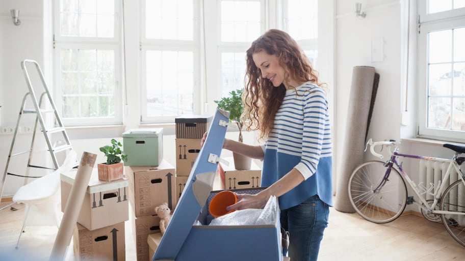 A woman in new apartment unpacking