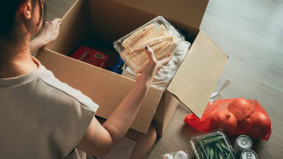  Woman unpacking food from a box 