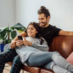 Young couple relaxing on sofa