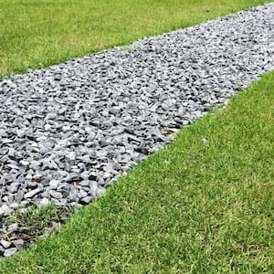 Gray gravel french drain