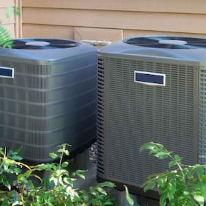 Two AC units outside a house