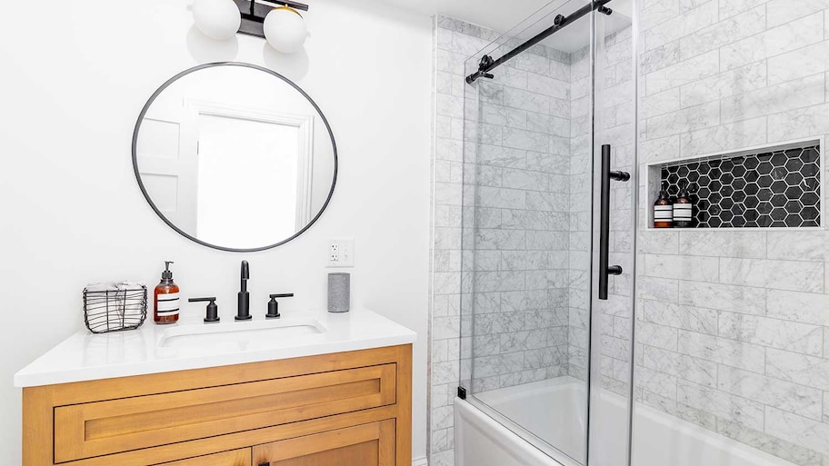 A view of a bathroom with a tiled shower