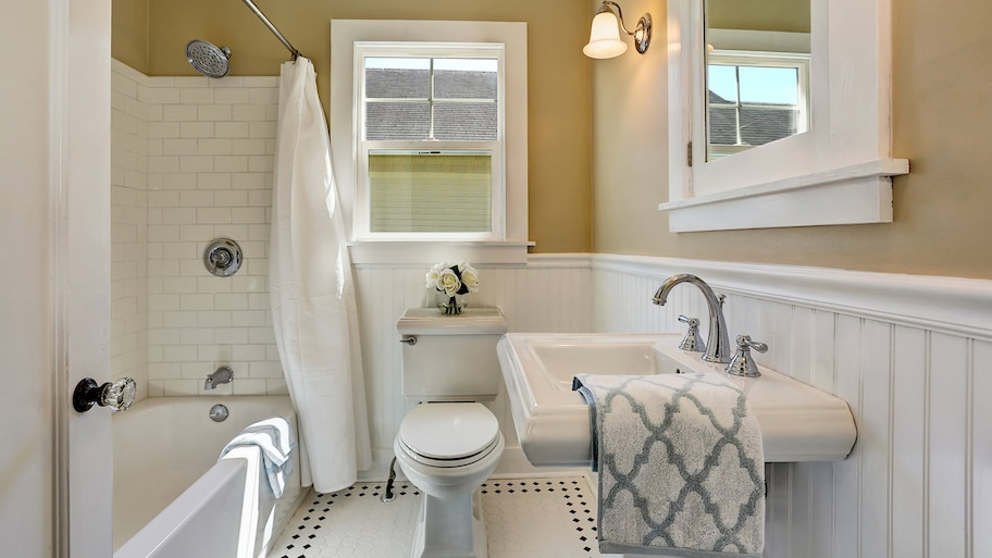 Full bathroom with white tile