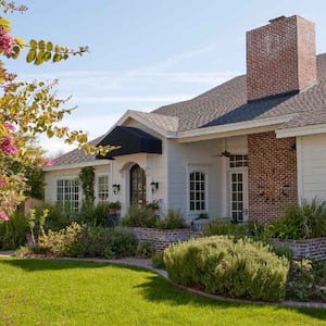 A beautiful house with lawn in the front yard 