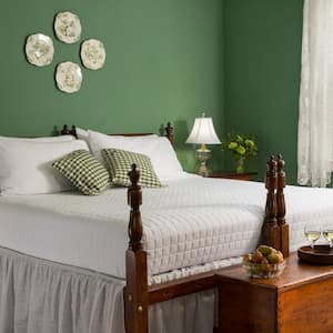 A bed in green bedroom