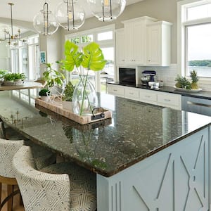 Open plan kitchen with black granite countertops