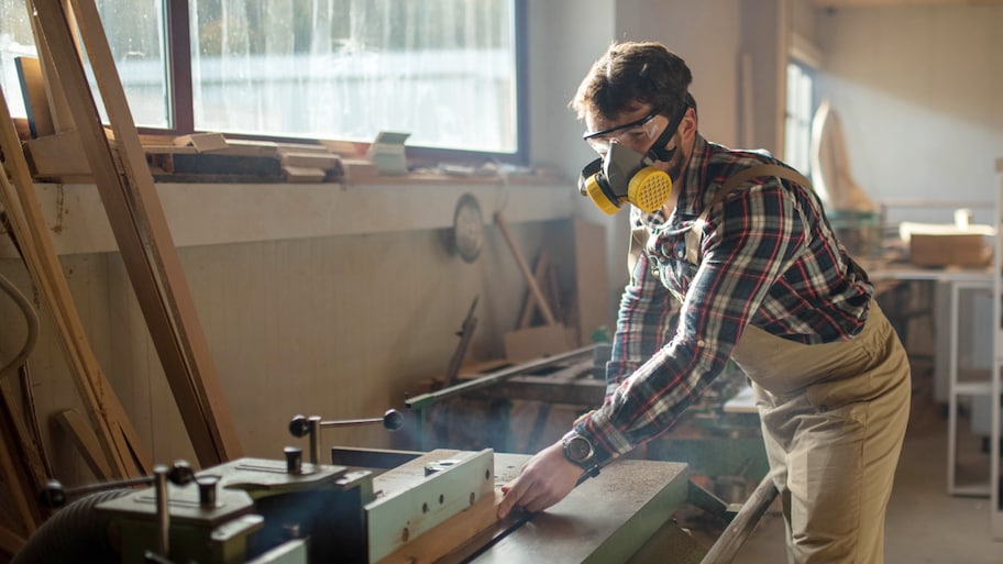 Carpenter working in wood shop