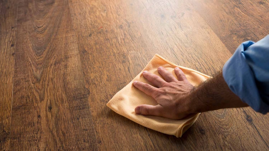 cleaning hardwood floor with microfiber cloth