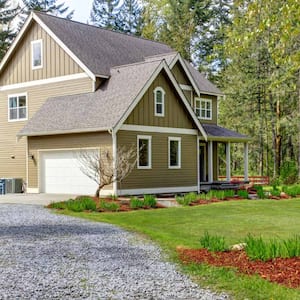 A countryside house entrance and gravel driveway