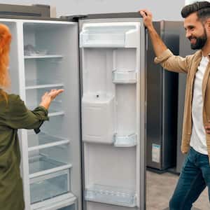 couple looking at refrigerators in store