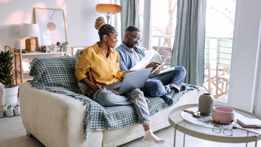 couple at home overlooking homeowners insurance