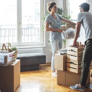 Young couple handle boxes for a move