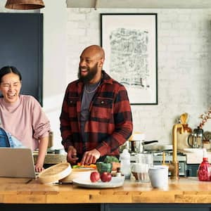 A couple preparing food in the kitchen 