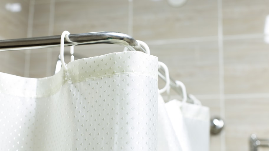 Detail of a white shower curtain