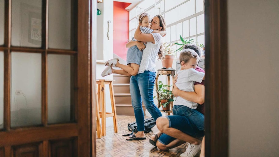 family hugging at home