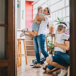 family hugging at home