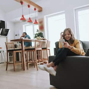 Family enjoying kitchen and living room open concept space