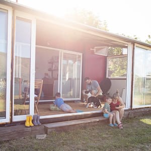 A family lounges in a shipping container home