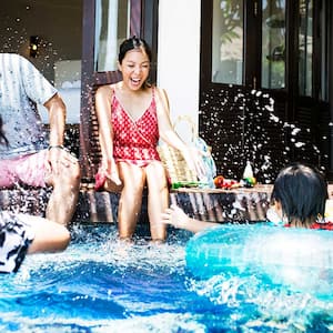 A family by a swimming pool