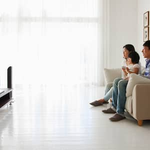 A family watching TV in living room