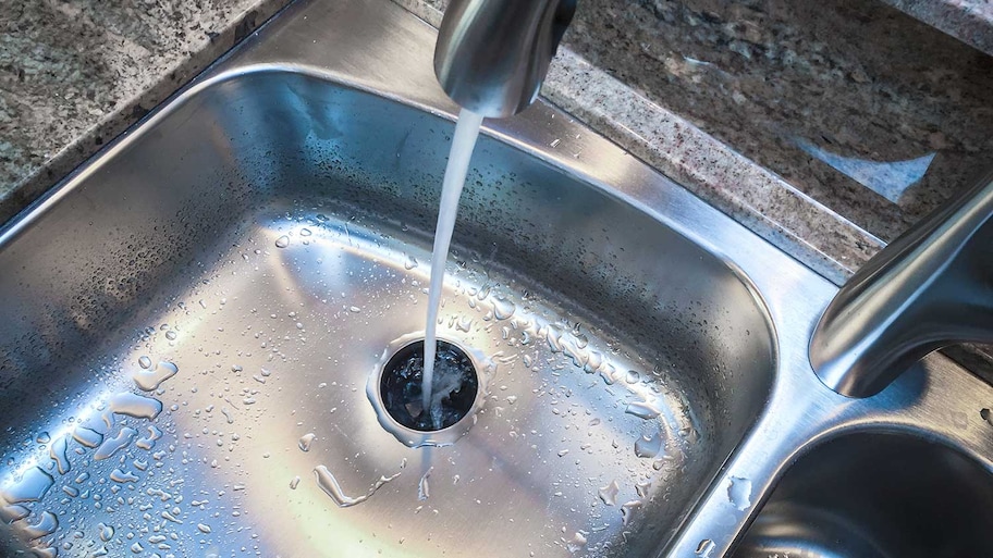 Kitchen sink with running water