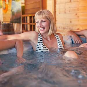 Group of friends relaxing in a hot tub