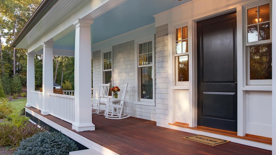 Front porch with rockers, blue ceiling and black front door