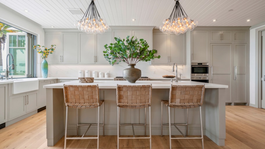 Modern grey kitchen island with chairs