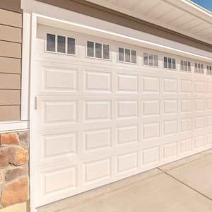 Residential garage door with white frame