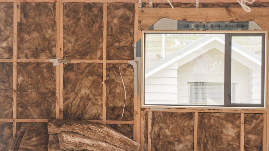 A large garage with insulation that’s under construction