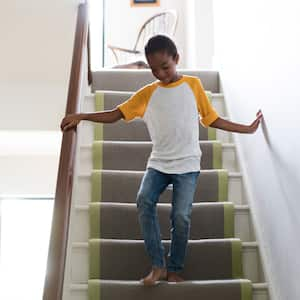 Full length of girl on staircase at home 