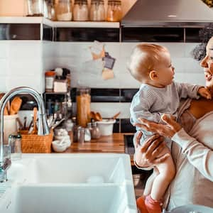 A grandmother and child in the kitchen