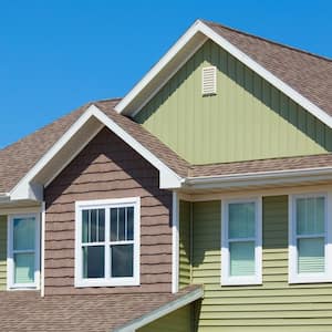 Green vinyl siding on the exterior of a house