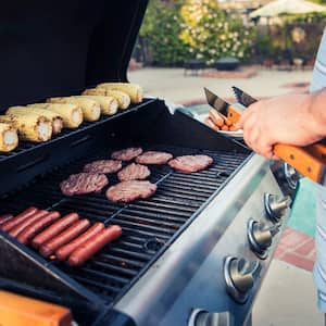 Close up of man grilling