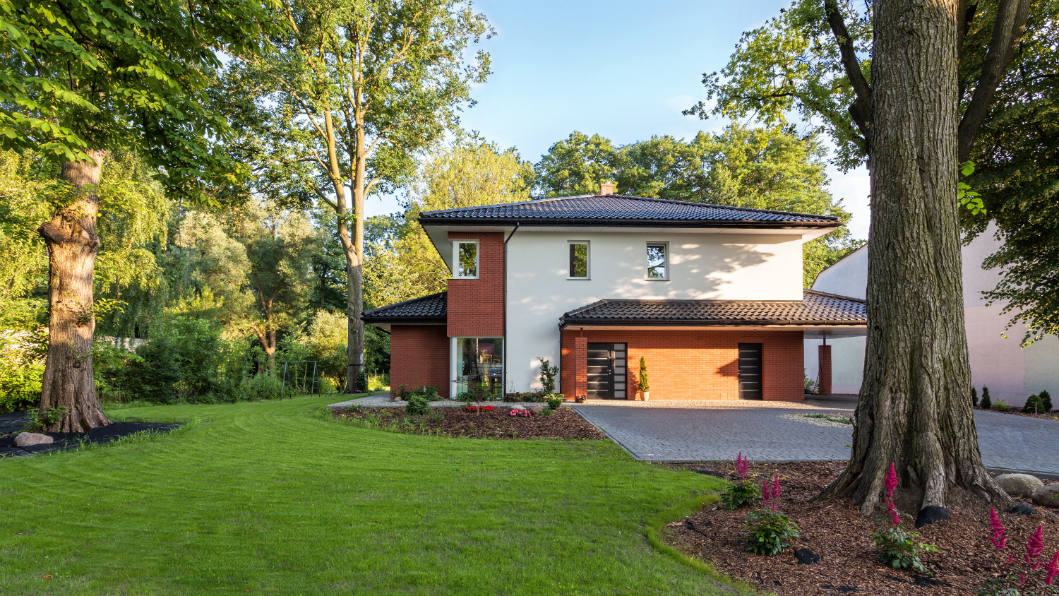 beautiful house surrounded by healthy  trees