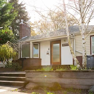 Exterior shot of a bungalow type of house on a sunny day