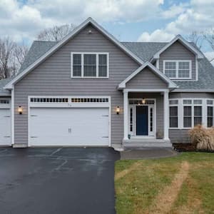 A house with freshly paved driveway