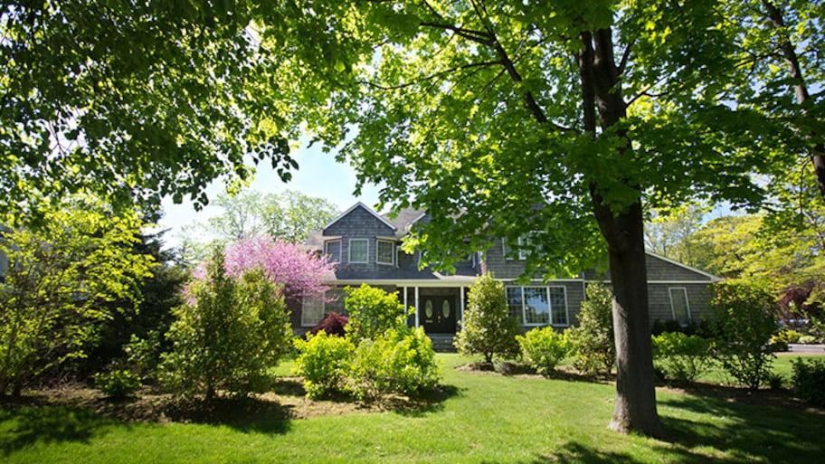 Home with beautiful trees and landscaping