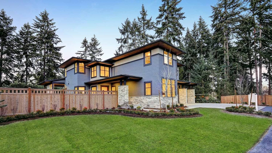 Nice wood fence around modern two-story house