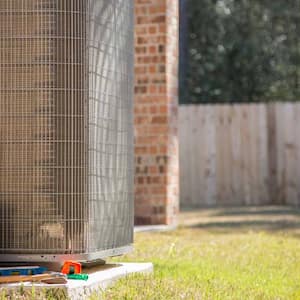 A HVAC unit in the backyard