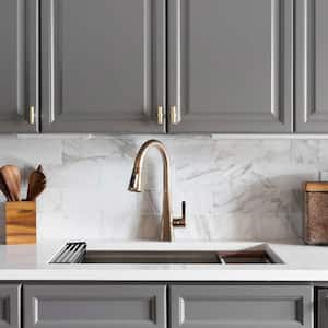 A kitchen with gray cabinets