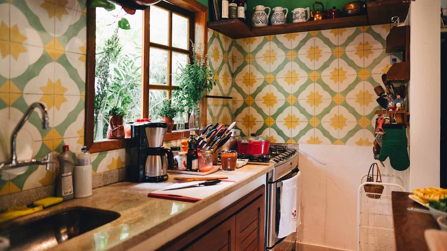 A kitchen with vintage ceramic tiles as backsplash