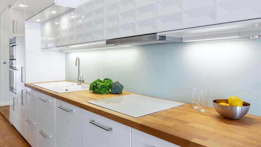 white kitchen with cabinet lighting 