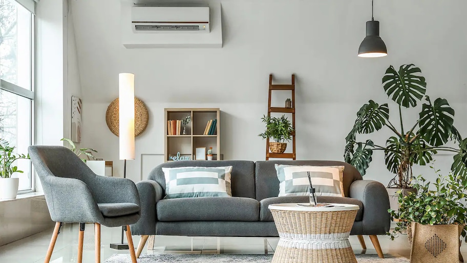 stylish living room with ac on wall